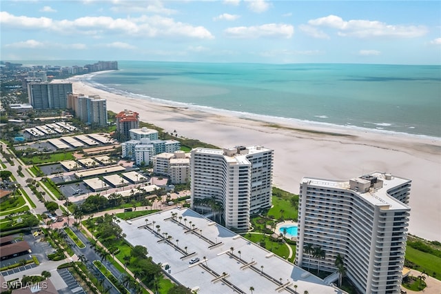 drone / aerial view featuring a view of the beach and a water view