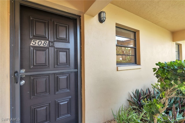 doorway to property featuring covered porch