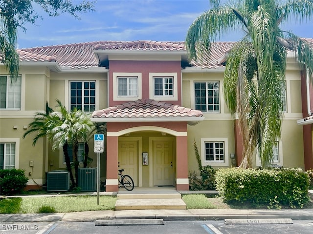 mediterranean / spanish-style home featuring cooling unit