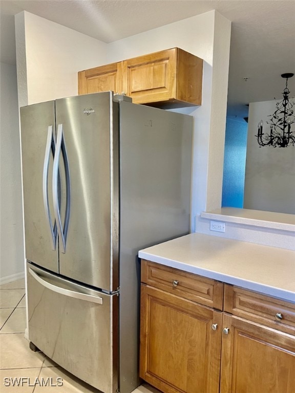 kitchen featuring stainless steel fridge and light tile patterned floors