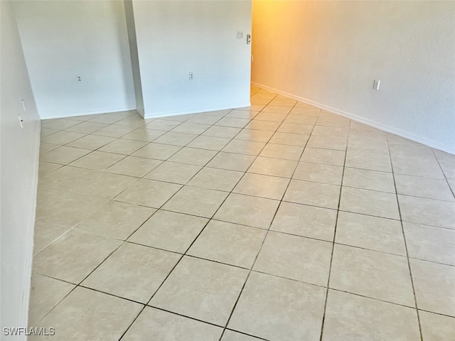 spare room featuring light tile patterned floors