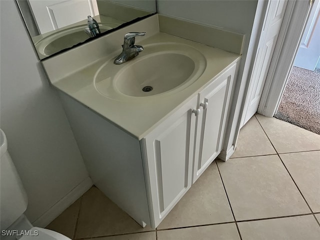 bathroom featuring tile patterned flooring and vanity