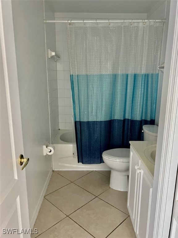 full bathroom with shower / bath combo with shower curtain, vanity, tile patterned flooring, and toilet