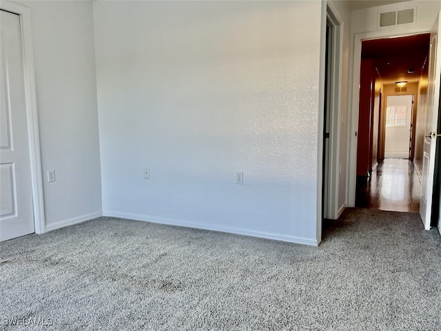 unfurnished bedroom featuring light colored carpet