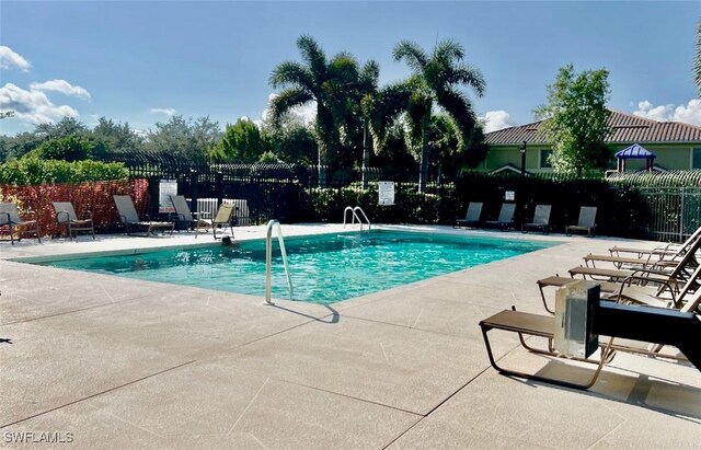 view of swimming pool with a patio area