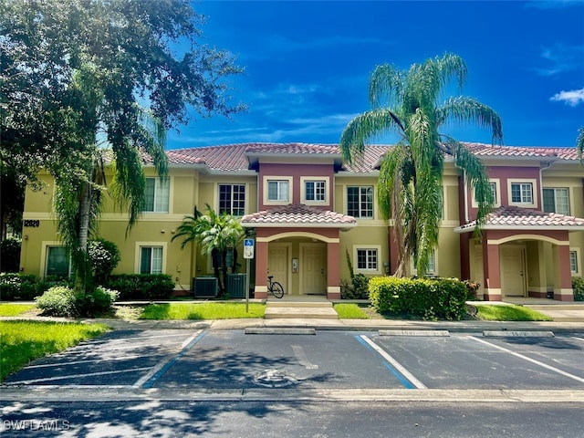 mediterranean / spanish-style house featuring cooling unit