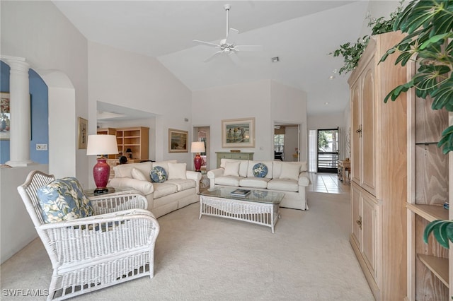 27026 Oakwood Lake Dr Unit 202, Bonita Springs, FL 34134 - living room with high vaulted ceiling, ornate columns, a ceiling fan, and light colored carpet