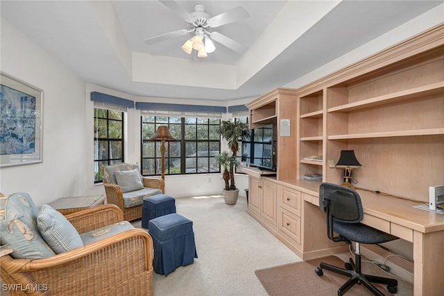 27026 Oakwood Lake Dr Unit 202, Bonita Springs, FL 34134 - office featuring built in desk, a raised ceiling, a ceiling fan, and light colored carpet
