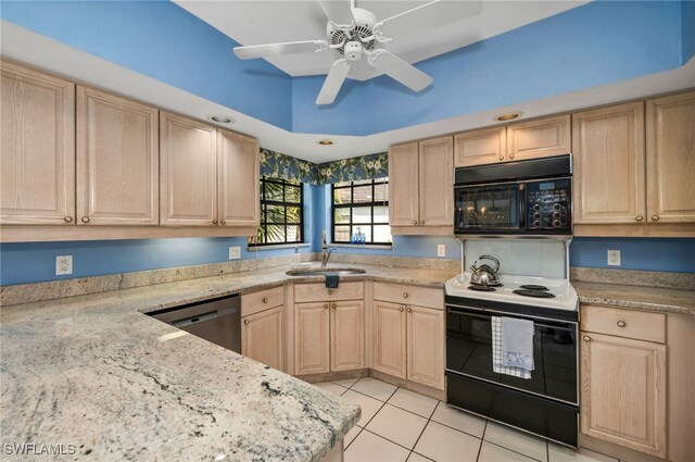 kitchen featuring light tile patterned flooring, black appliances, sink, and light brown cabinets