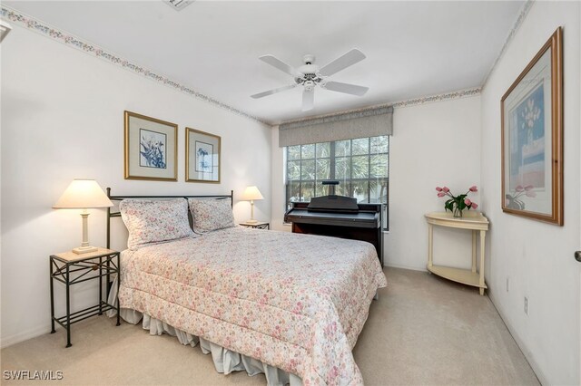 carpeted bedroom featuring ceiling fan