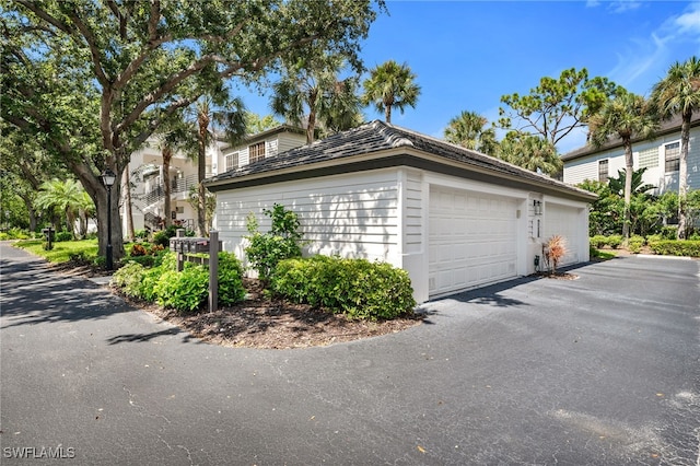 view of side of property featuring a garage