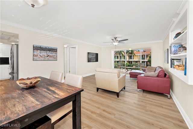 living room featuring ceiling fan, light wood-type flooring, and ornamental molding