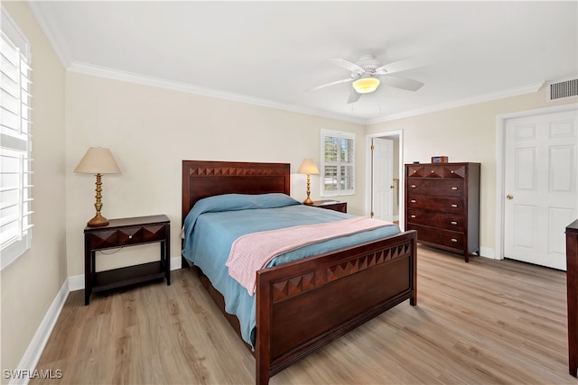 bedroom featuring ceiling fan, light hardwood / wood-style floors, and ornamental molding