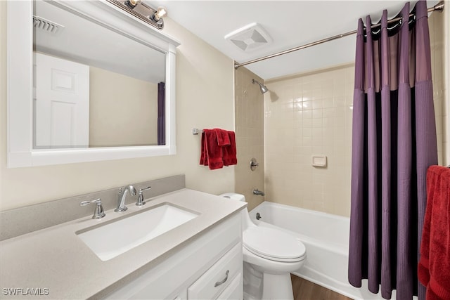 full bathroom featuring vanity, toilet, and shower / tub combo with curtain