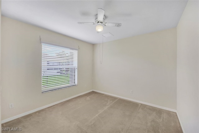 unfurnished room with light carpet and ceiling fan