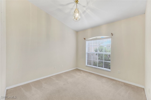 unfurnished room featuring light colored carpet