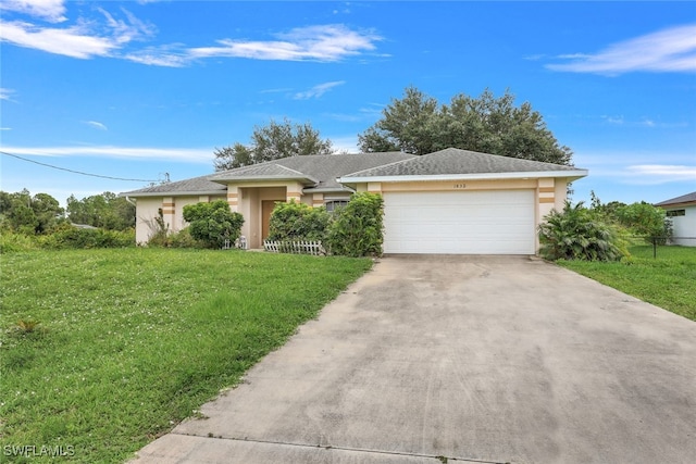 ranch-style home featuring a garage and a front lawn