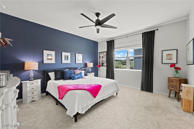 bedroom featuring ceiling fan and light colored carpet