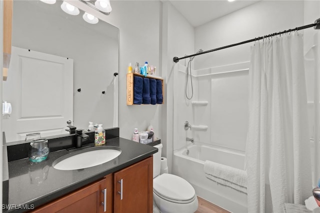 full bathroom featuring shower / tub combo with curtain, vanity, toilet, and hardwood / wood-style flooring