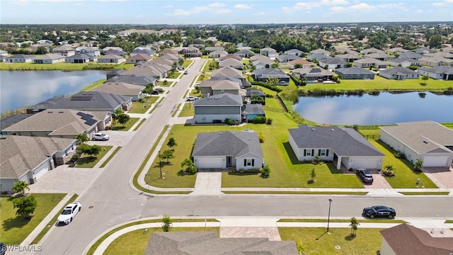 drone / aerial view featuring a water view