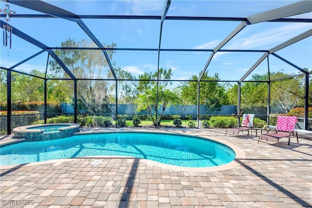 view of swimming pool featuring glass enclosure, a patio, and a pool with connected hot tub