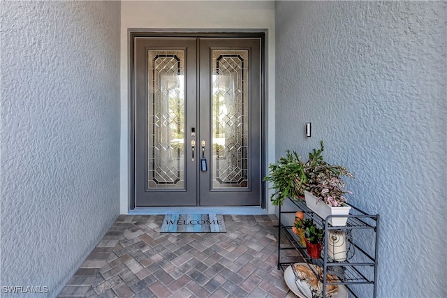 doorway to property with french doors