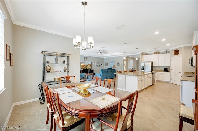 tiled dining room featuring ceiling fan with notable chandelier and ornamental molding