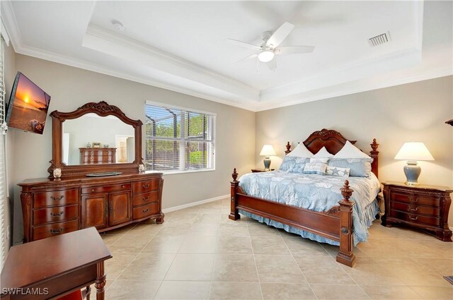 bedroom with a raised ceiling, light tile patterned floors, ornamental molding, and ceiling fan