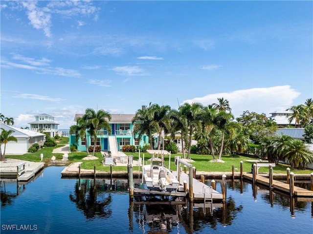 dock area featuring a lawn and a water view