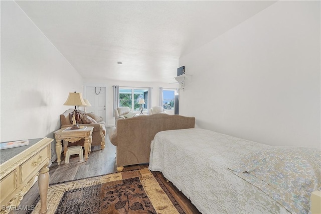 bedroom with hardwood / wood-style floors