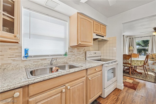 kitchen with sink, light brown cabinets, light hardwood / wood-style flooring, white range with electric cooktop, and decorative backsplash