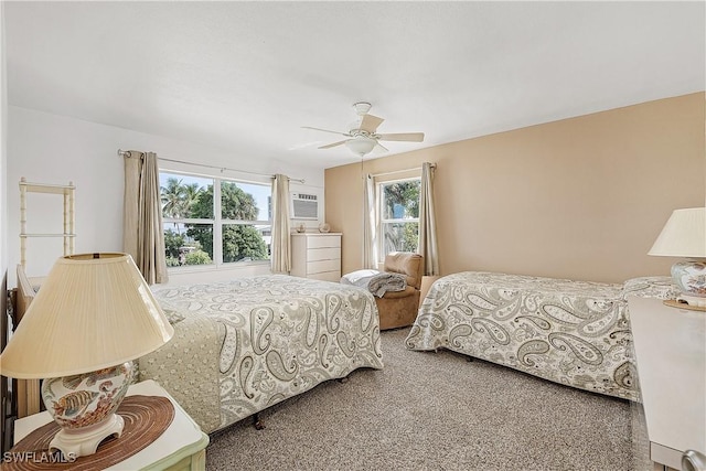 carpeted bedroom with ceiling fan, a wall mounted AC, and multiple windows