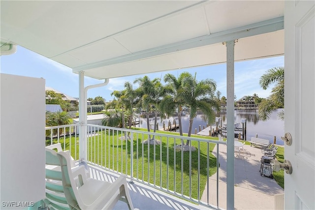 balcony featuring a water view