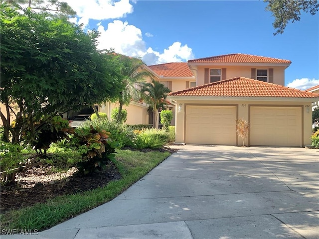 mediterranean / spanish-style home featuring a garage