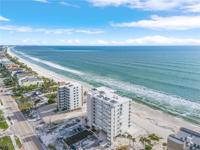 aerial view featuring a water view and a beach view