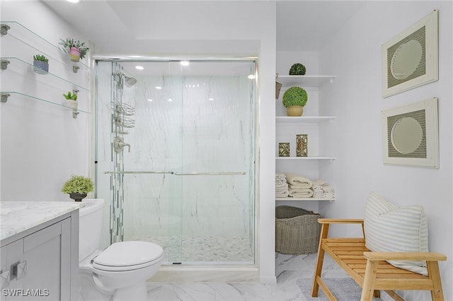 bathroom with vanity, toilet, and walk in shower