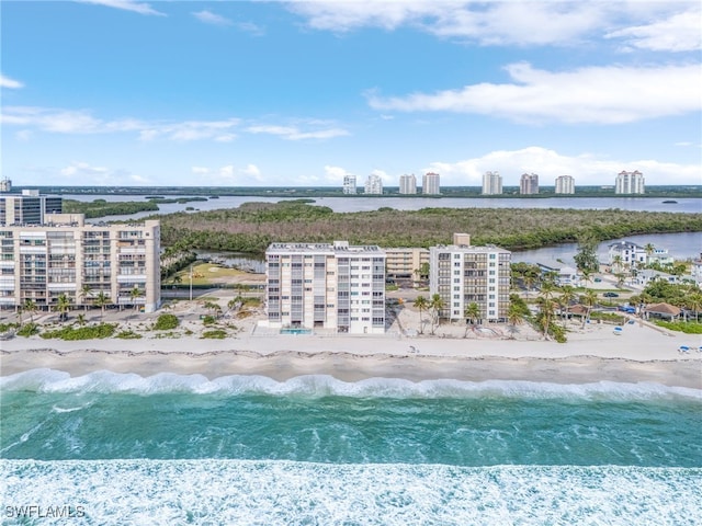 birds eye view of property featuring a water view and a view of the beach