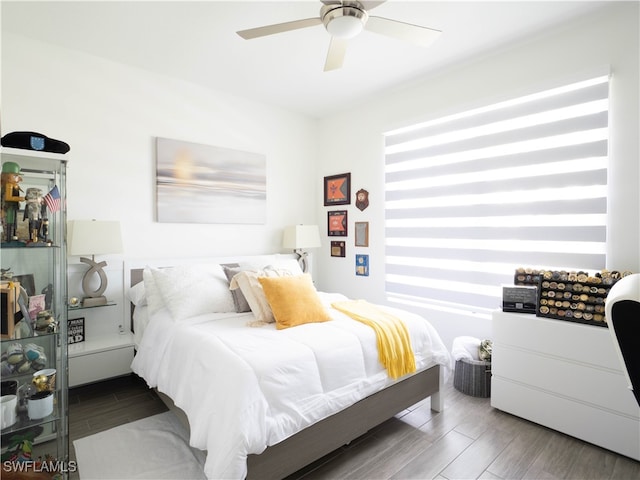 bedroom featuring wood-type flooring and ceiling fan