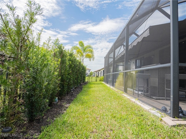 view of yard featuring a lanai