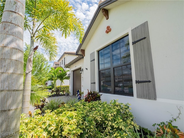 doorway to property featuring a garage