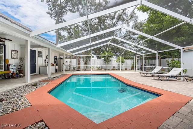 view of pool featuring a lanai and a patio area