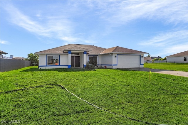 ranch-style home featuring a front yard and a garage