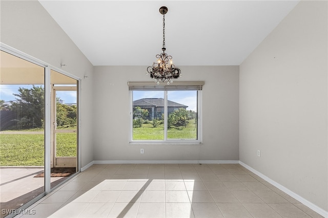 unfurnished dining area featuring vaulted ceiling, a chandelier, and light tile patterned floors