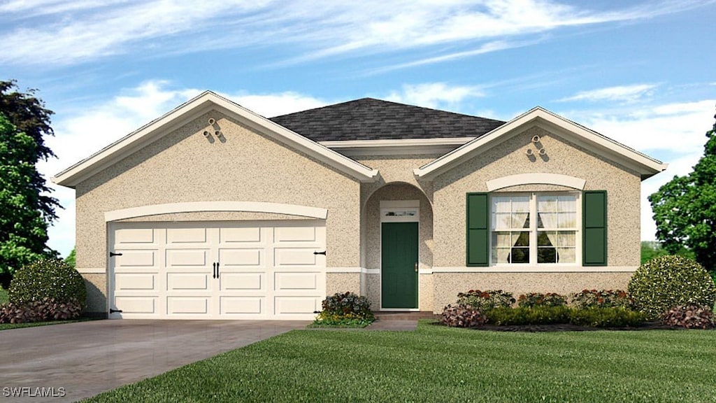 view of front of property with a garage and a front lawn