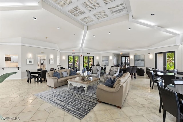 living room with a healthy amount of sunlight, lofted ceiling, and french doors