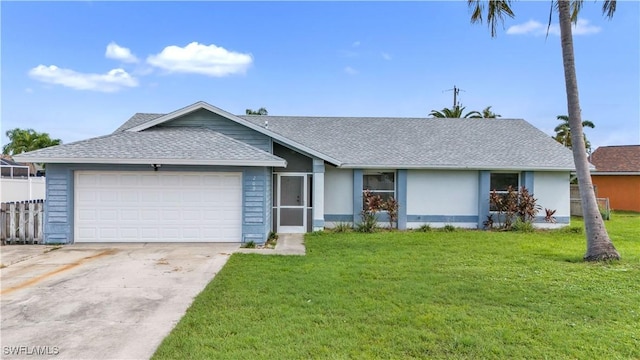 ranch-style house with a front yard and a garage