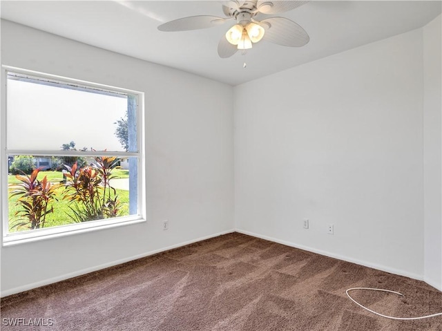 spare room with carpet and ceiling fan