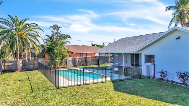 view of swimming pool featuring a yard