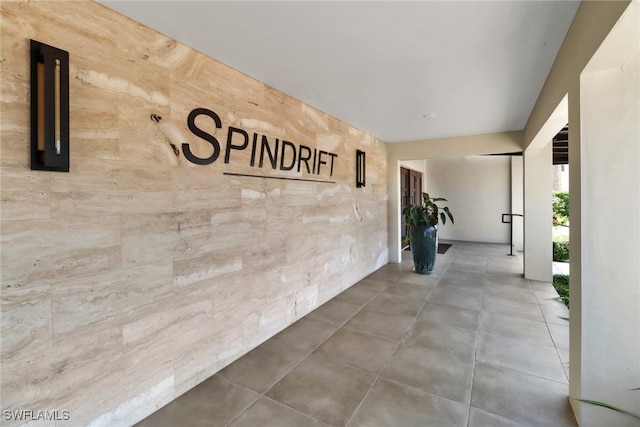 hallway featuring tile patterned flooring