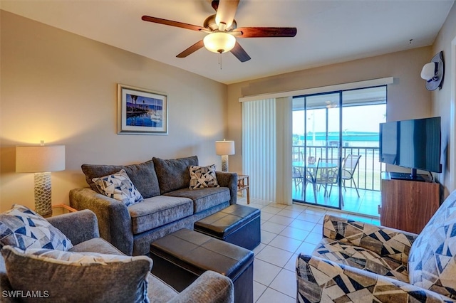 living room featuring light tile patterned flooring and ceiling fan